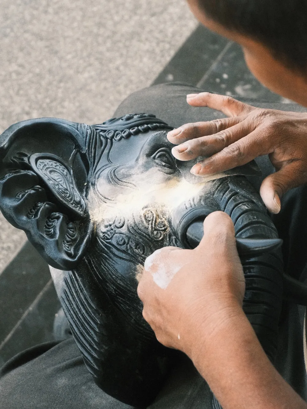 Hand-finishing the Elephant Wall Planter